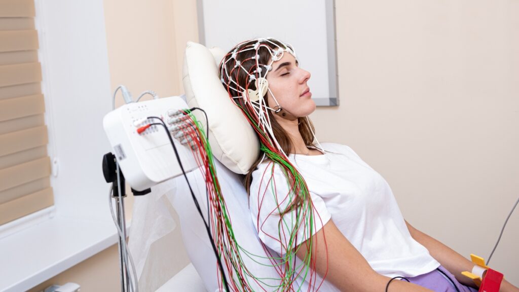 A woman enjoys TMS therapy 