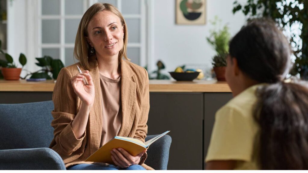 Teen psychiatrist guiding a teen through their first appointment.