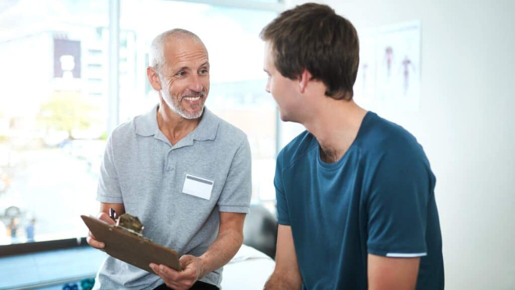 Man consulting with a healthcare provider at a Suboxone clinic.