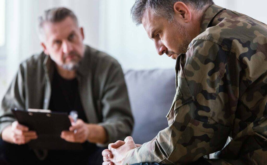 Man getting professional support for trauma-related anxiety and addiction.