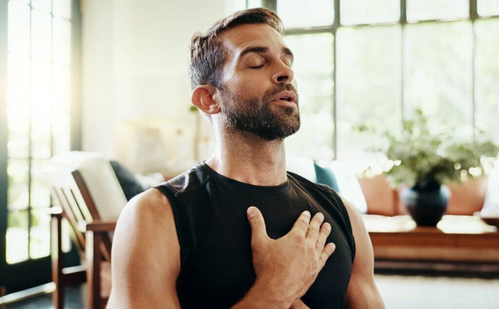 Man using breathing exercises for nervous system regulation.