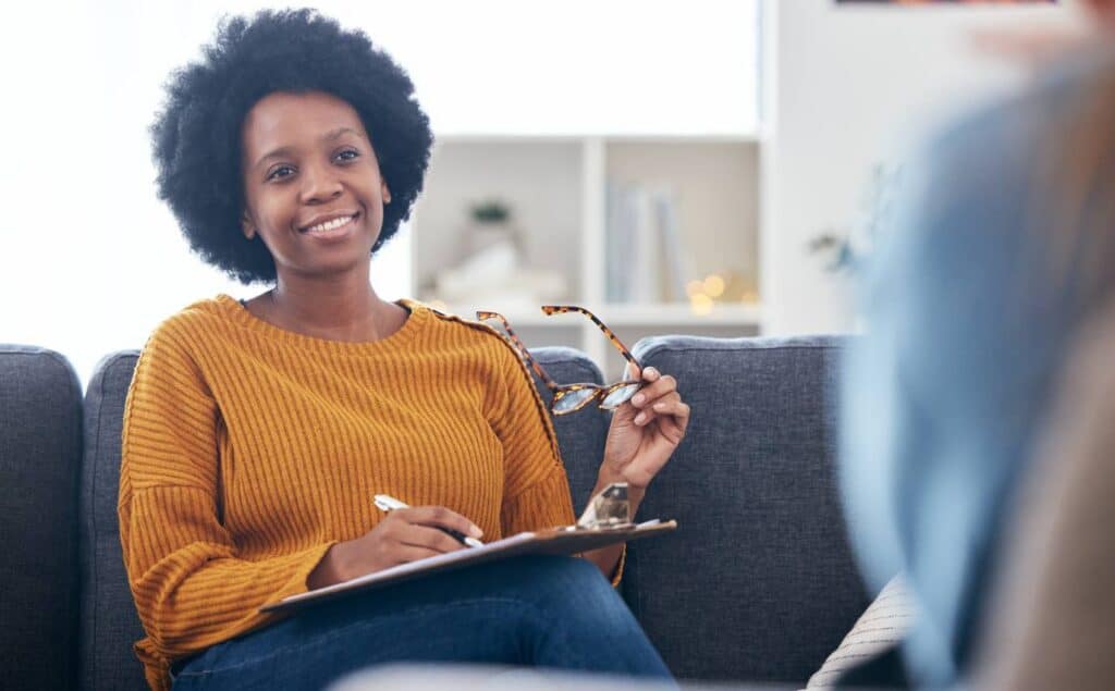 Psychotherapist supporting a client in nervous system regulation.