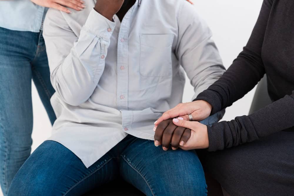 People sharing feelings during PTSD treatment in Portland Oregon group counseling session