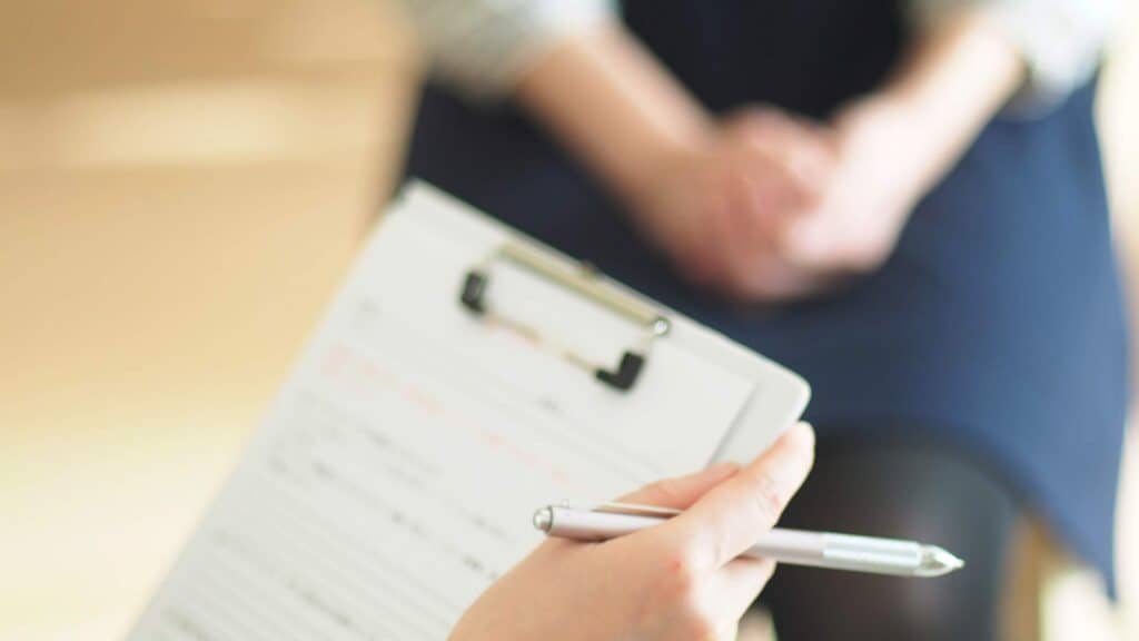 A treatment plan on paper outlining the benefits of combining medication with TMS therapy